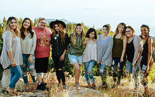 Group of happy people at an outdoor retreat.